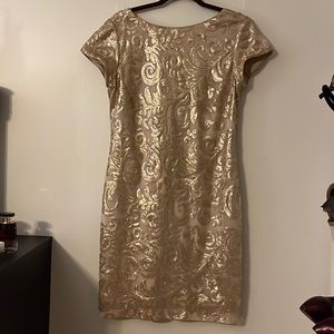 Perfect party dress. Gold sequins detail throughout.